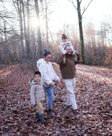 Family walking together on an autumn path