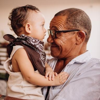 Grandfather holding his grandchild close